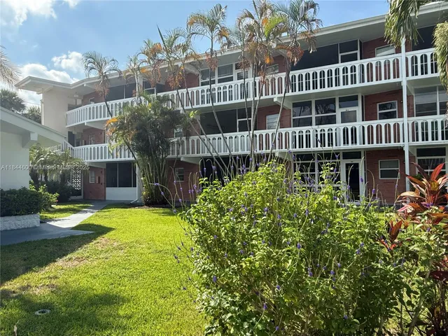 a view of a park with swings and slides
