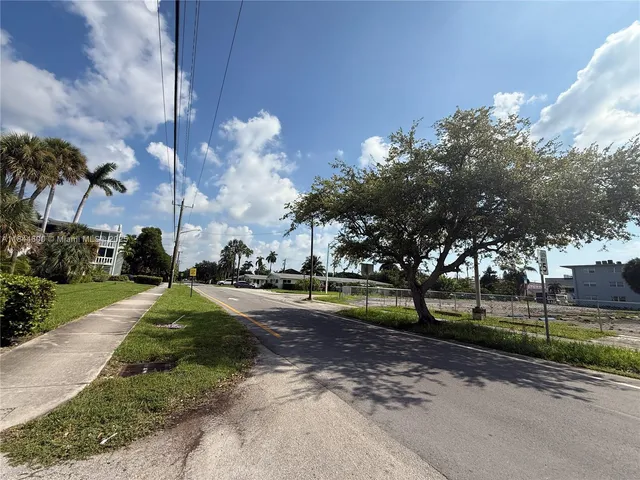 a view of a swimming pool with a yard