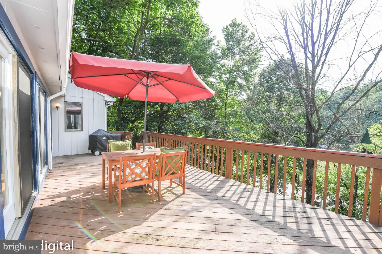 6712 West Lakeridge Road New Market, MD 21774 - Photo 11 of 30 Deck the whole length of the home overlooking lake