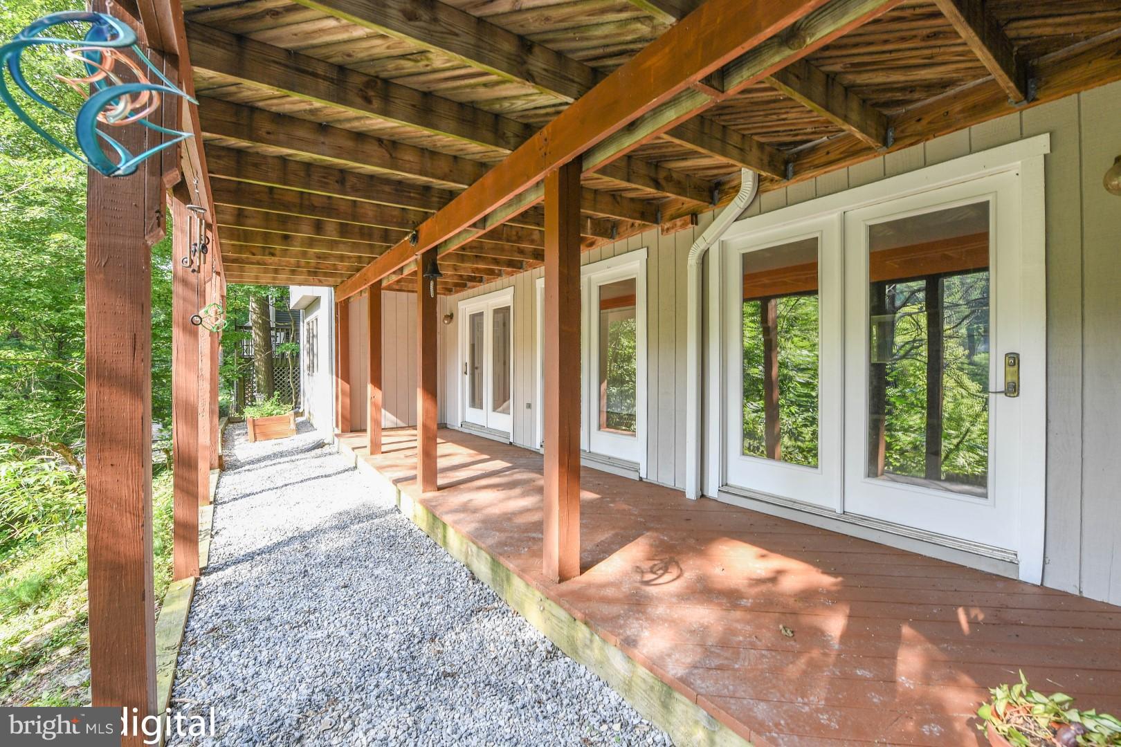 6712 West Lakeridge Road New Market, MD 21774 - Photo 27 of 30 Patio under deck w bank of glass doors for views