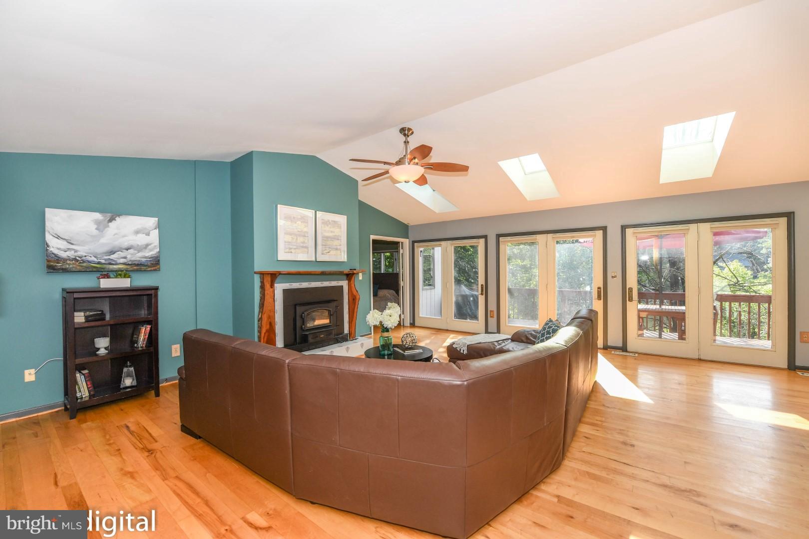 6712 West Lakeridge Road New Market, MD 21774 - Photo 7 of 30 Full wall of glass doors overlooking deck and lake