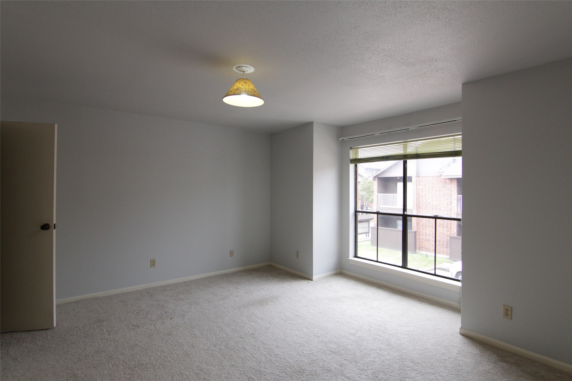3100 Walnut Bend Lane, Unit 118 Houston, TX 77042 - Photo 12 of 20 an empty room with windows