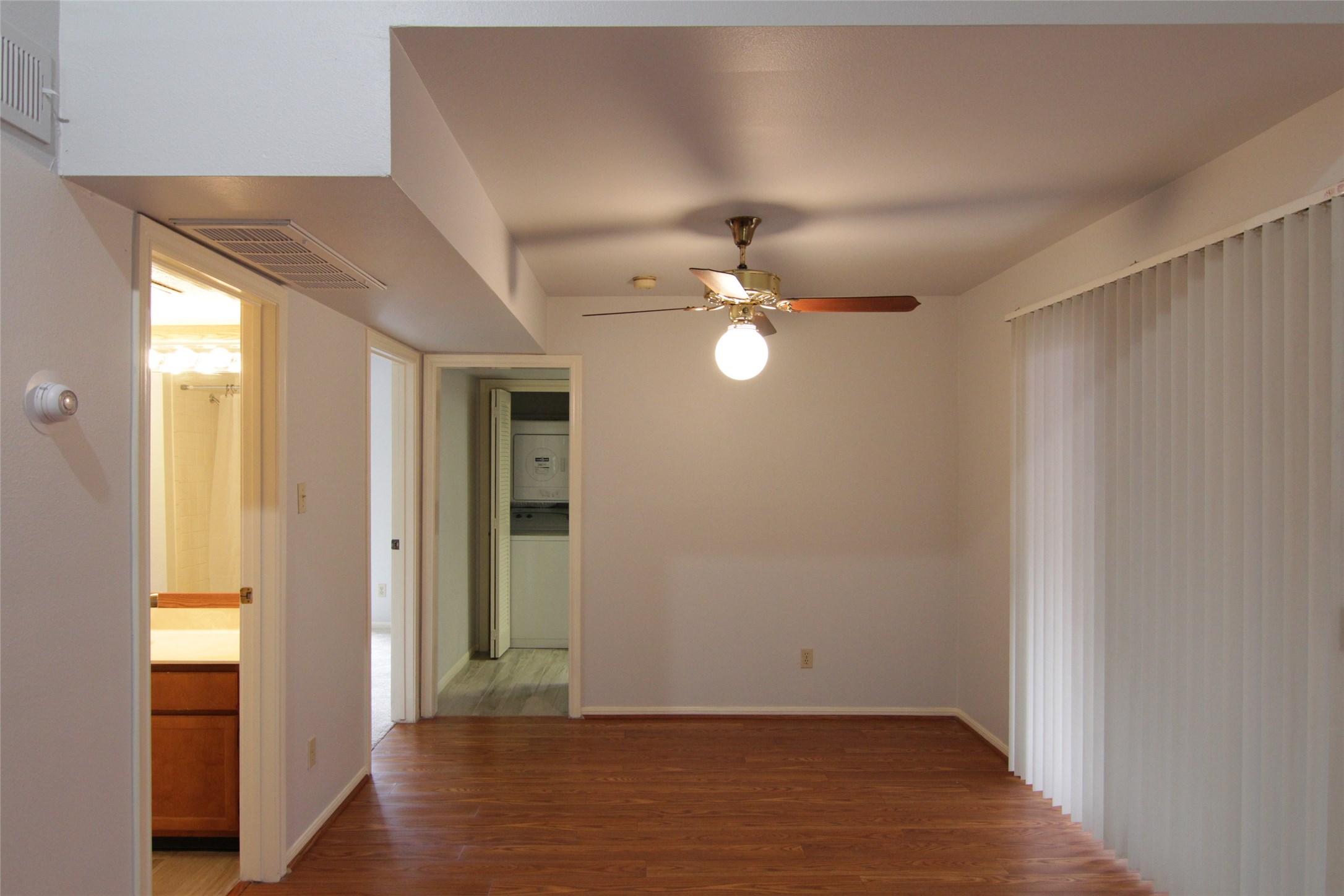 3100 Walnut Bend Lane, Unit 118 Houston, TX 77042 - Photo 5 of 20 a view of an empty room with wooden floor and closet