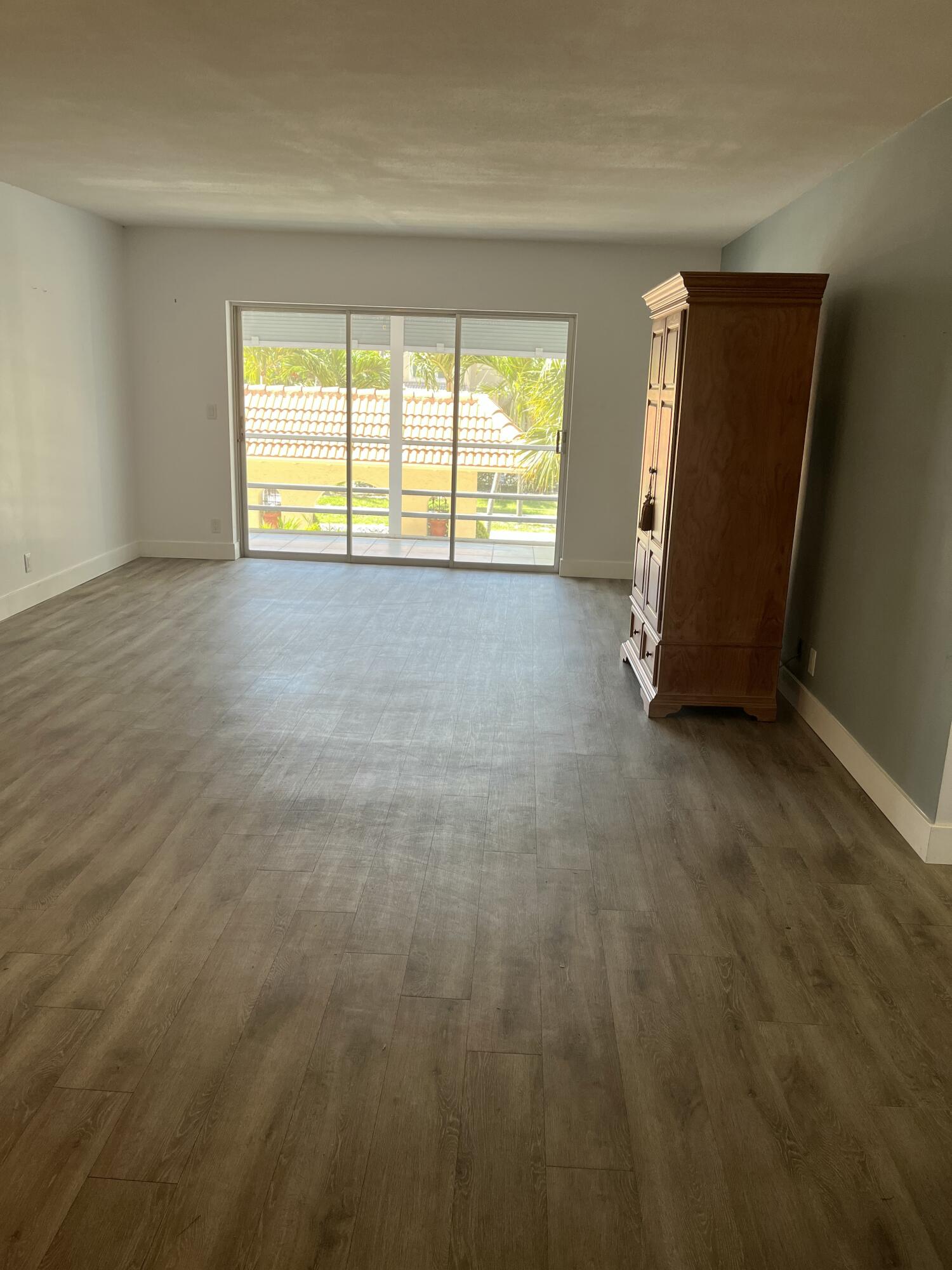 331 Southwest 8th Street, Unit 2CE Boca Raton, FL 33432 - Photo 4 of 19 a view of an empty room with a window