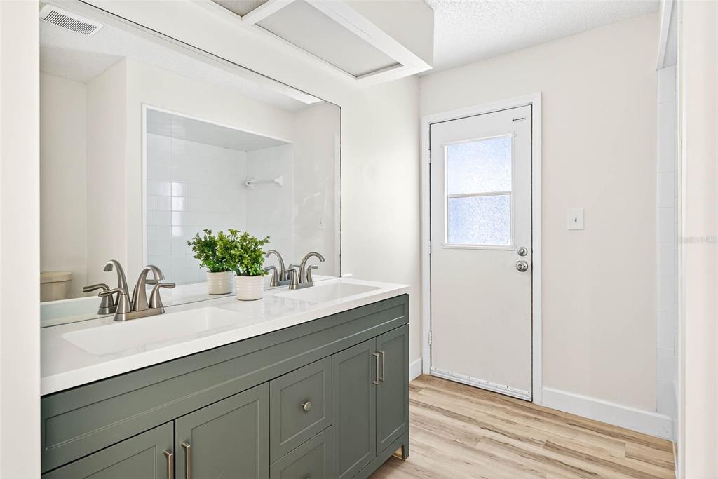 14252 Trinity Road Brooksville, FL 34614 - Photo 13 of 26 a bathroom with a sink and a mirror