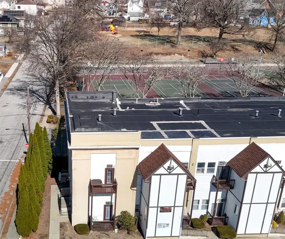 a view of a street with cars parked