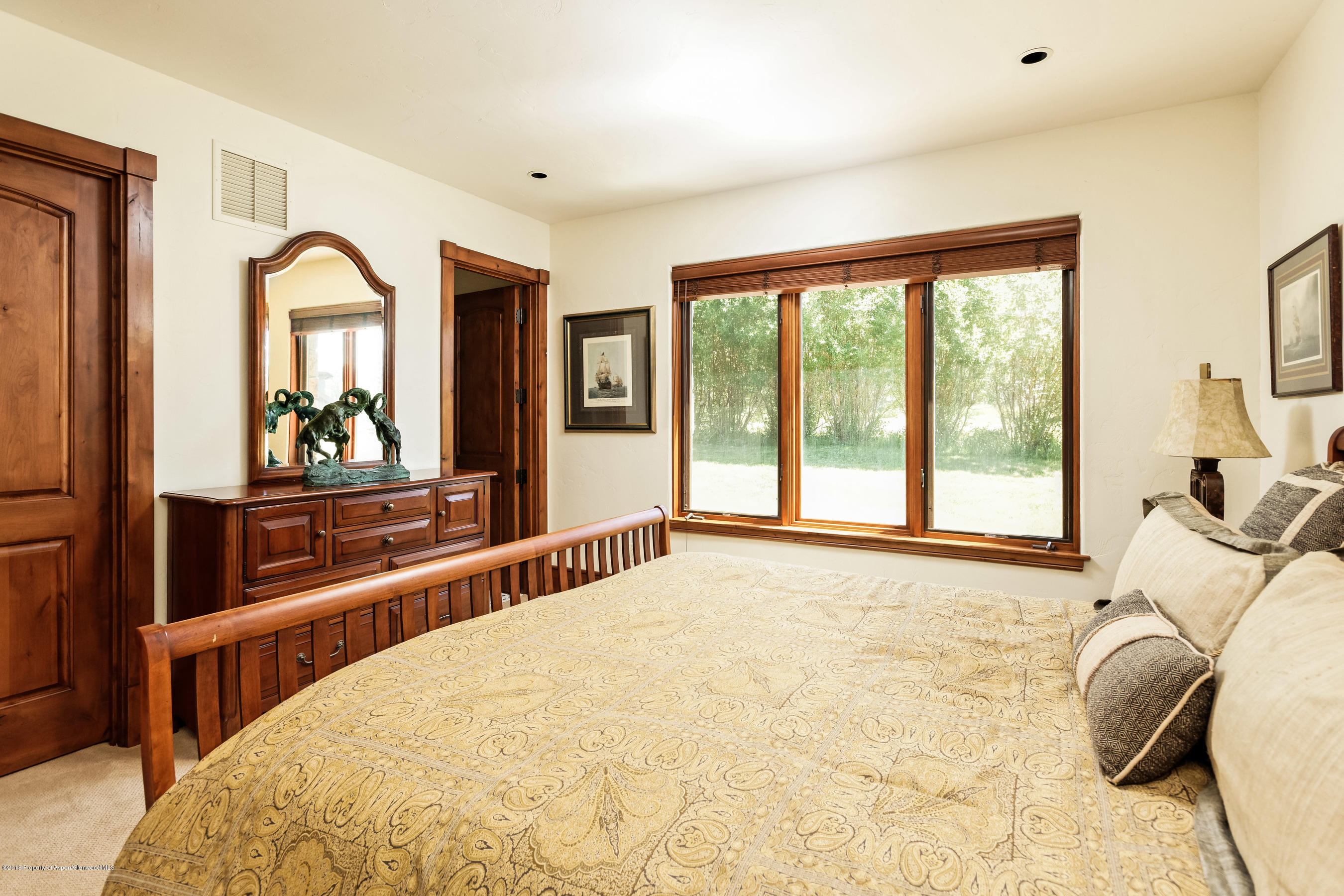 268 River's Bend Carbondale, CO 81623 - Photo 12 of 15 a bedroom with a bed and a large window with outer view