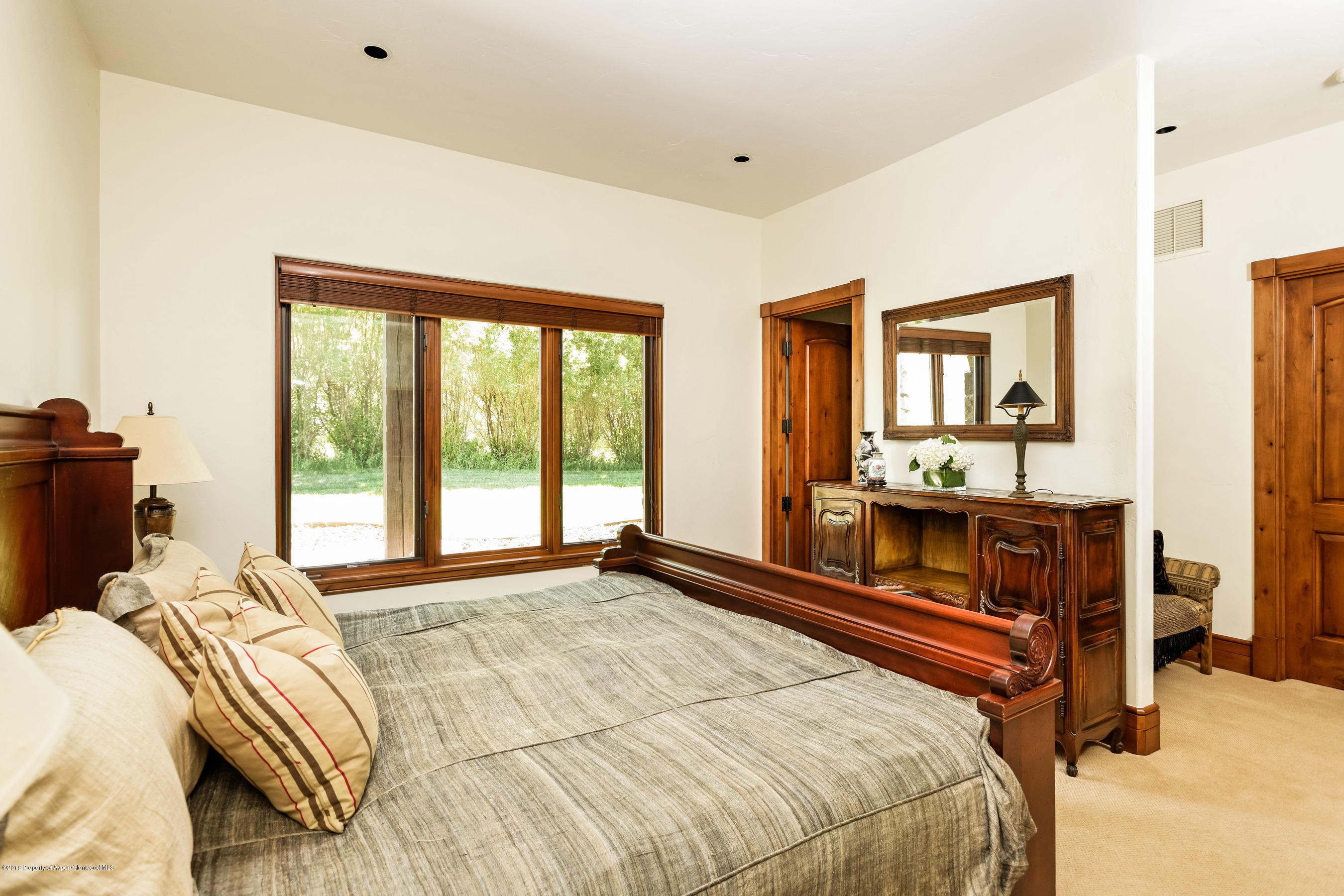 268 River's Bend Carbondale, CO 81623 - Photo 13 of 15 a bed sitting in a bedroom next to a window