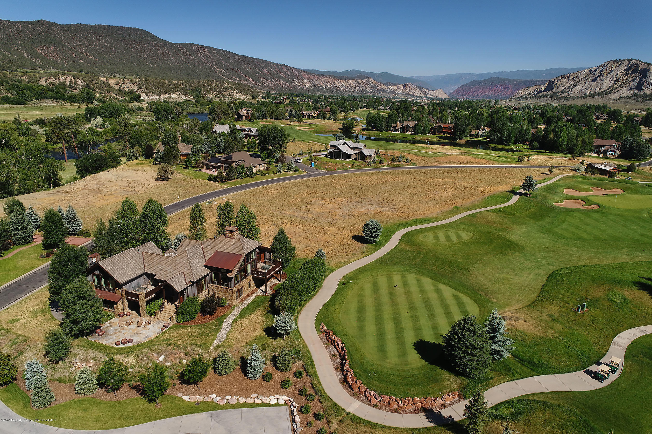 268 River's Bend Carbondale, CO 81623 - Photo 2 of 15 a view of a swimming pool with a yard and mountain view