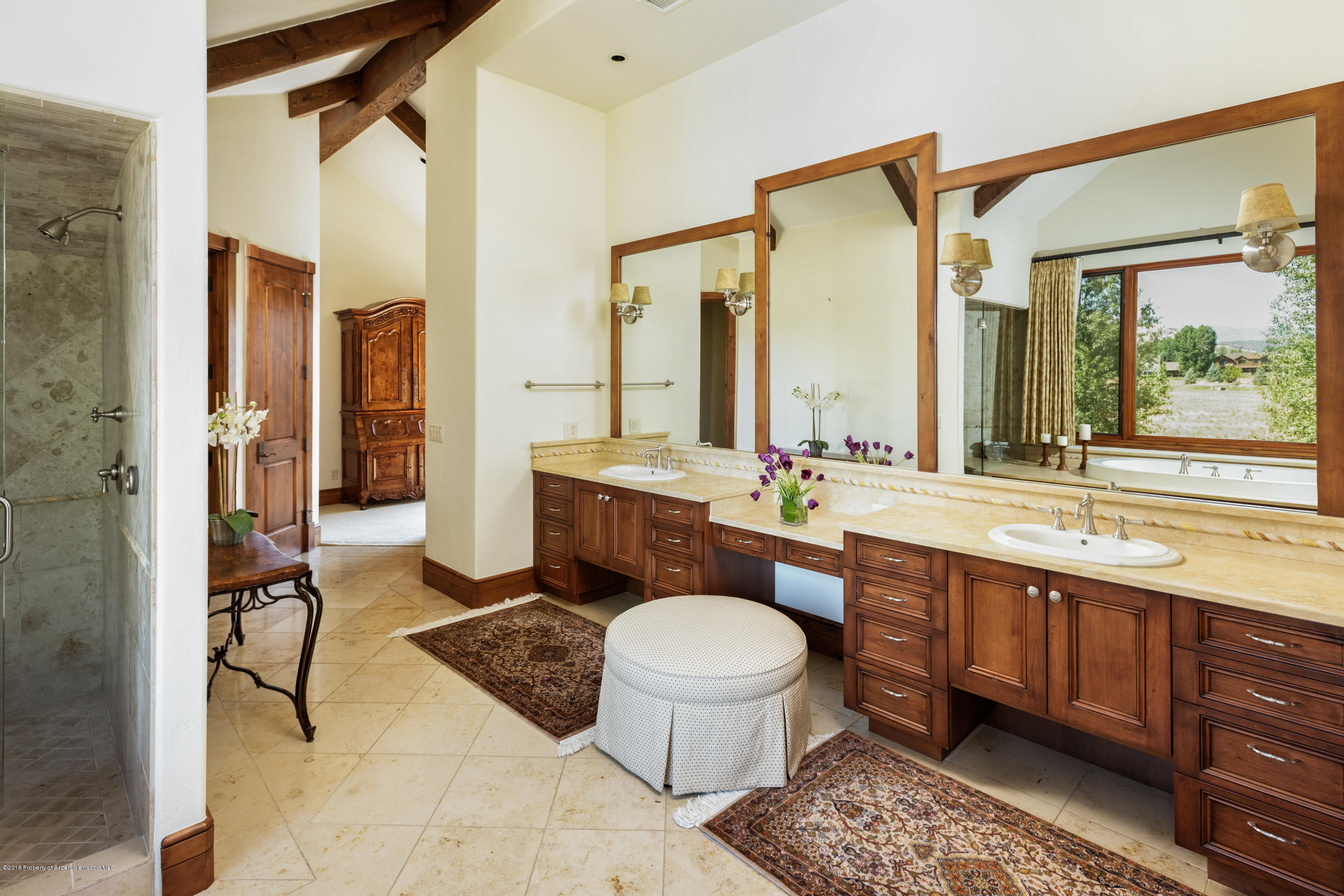 268 River's Bend Carbondale, CO 81623 - Photo 10 of 15 a spacious bathroom with a double vanity sink toilet mirror and bathtub