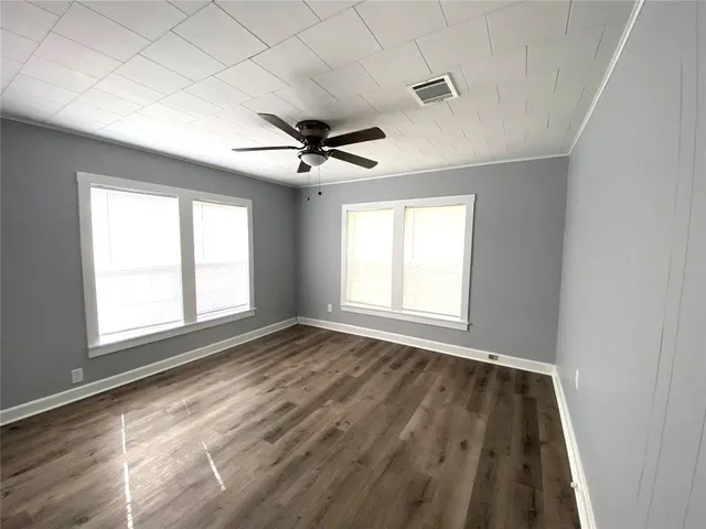 a view of an empty room with a window