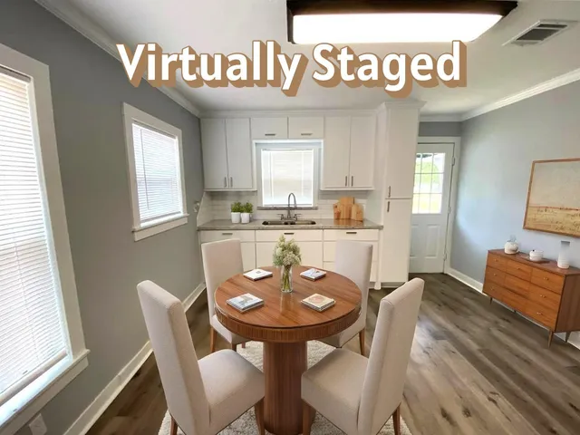 a view of a dining room with furniture and a window