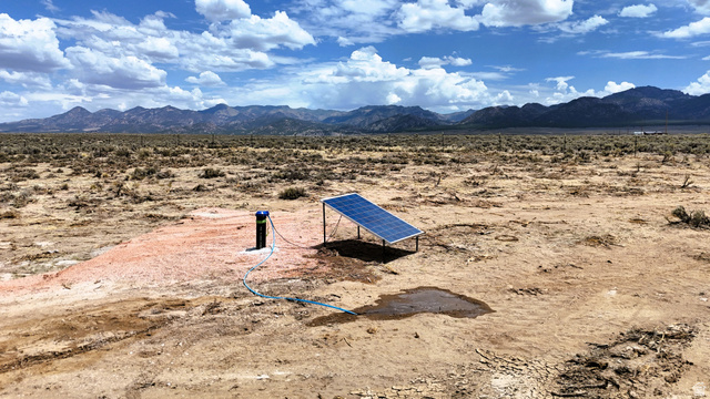 123 East Tbd 5000 Road North Panguitch, UT 84759 - Photo 5 of 54 Solar panel array powering a wellhead system in a vast, open landscape with distant mountains