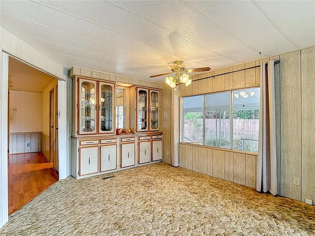 a spacious bedroom with a bed and a couch