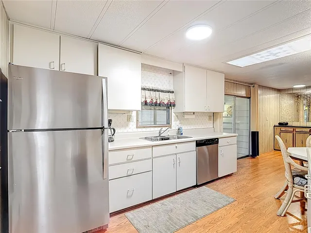 a kitchen with stainless steel appliances a stove and a refrigerator
