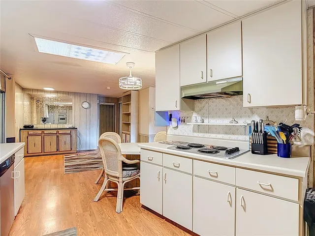 a spacious bedroom with a bed and a large window