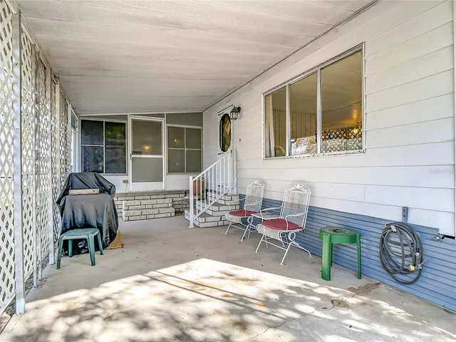 a spacious bedroom with a bed and a couch