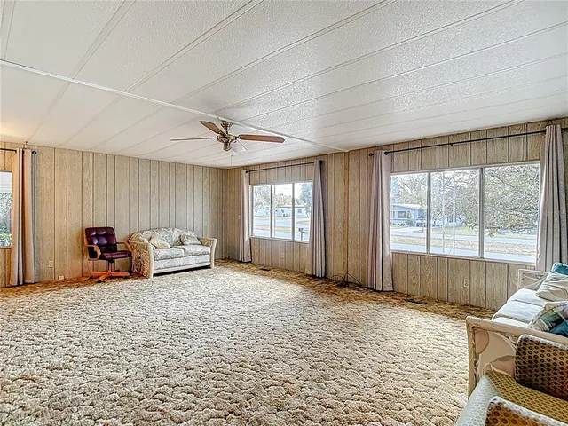 a spacious bedroom with a bed and a couch