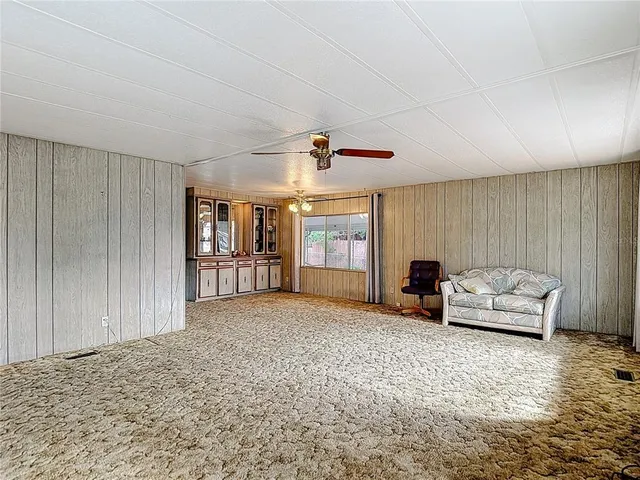 a large bedroom with a large bed and a large window