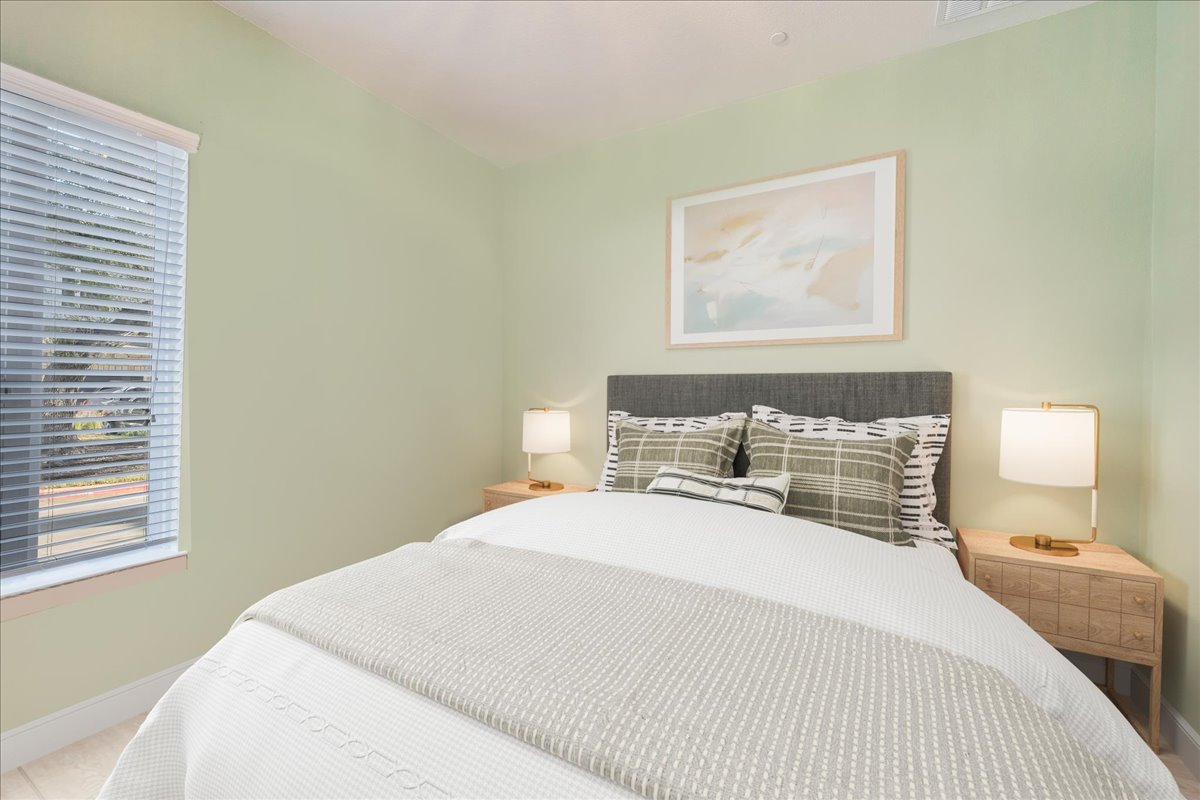 8922 Manchaca Road, Unit 906 Austin, TX 78748 - Photo 8 of 29 a bedroom with a bed and a window