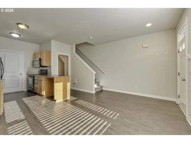 a view of kitchen with furniture and wooden floor