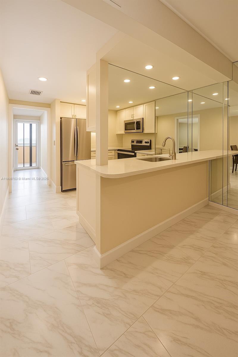 Hialeah Hialeah, FL 33016 - Photo 15 of 15 a view of large kitchen with stainless steel appliances kitchen island