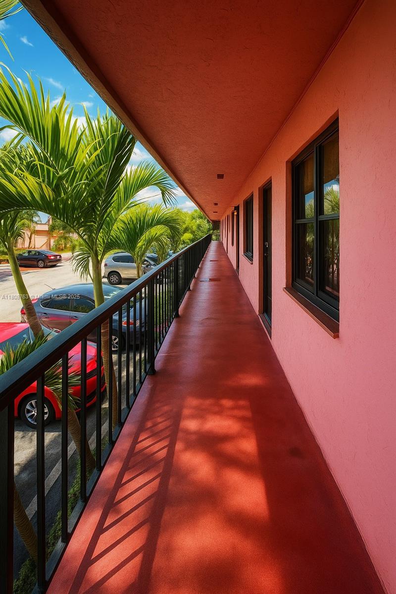 Hialeah Hialeah, FL 33016 - Photo 4 of 15 a balcony with wooden floor and outdoor space