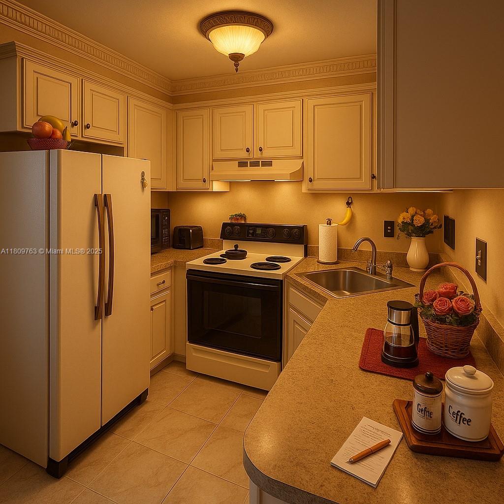 Hialeah Hialeah, FL 33016 - Photo 5 of 15 a kitchen with a refrigerator and a stove