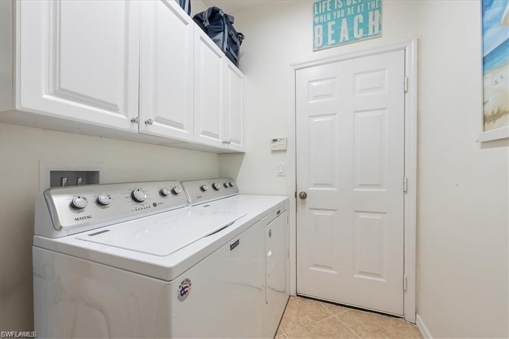 8432 Indian Wells Way Naples, FL 34113 - Photo 15 of 27 a utility room with dryer and washer