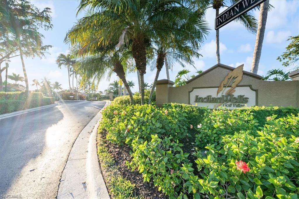 8432 Indian Wells Way Naples, FL 34113 - Photo 26 of 27 a view of a backyard of a house