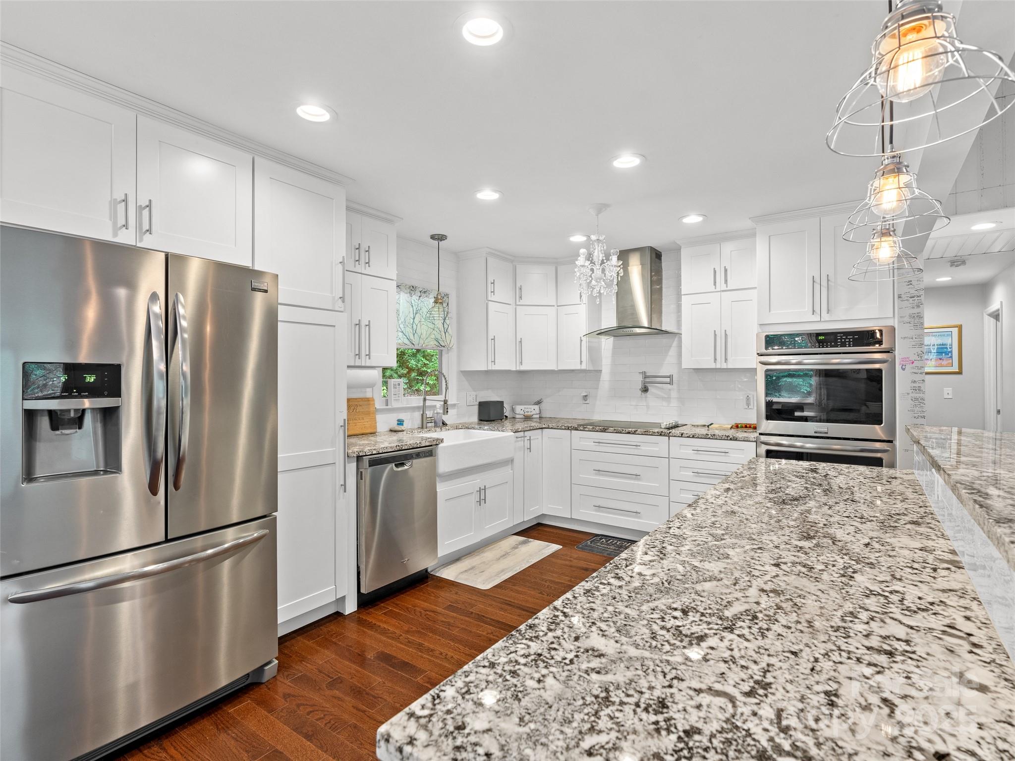 220 Deer Run Road Canton, NC 28716 - Photo 12 of 46 a kitchen with stainless steel appliances granite countertop a refrigerator and a stove top oven
