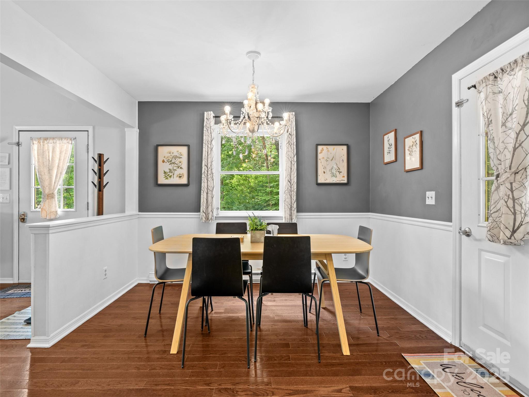 220 Deer Run Road Canton, NC 28716 - Photo 13 of 46 a view of a dining room with furniture window and wooden floor