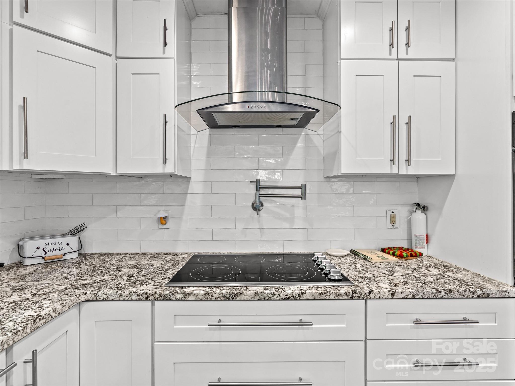 220 Deer Run Road Canton, NC 28716 - Photo 17 of 46 a kitchen with granite countertop white cabinets and a white stove