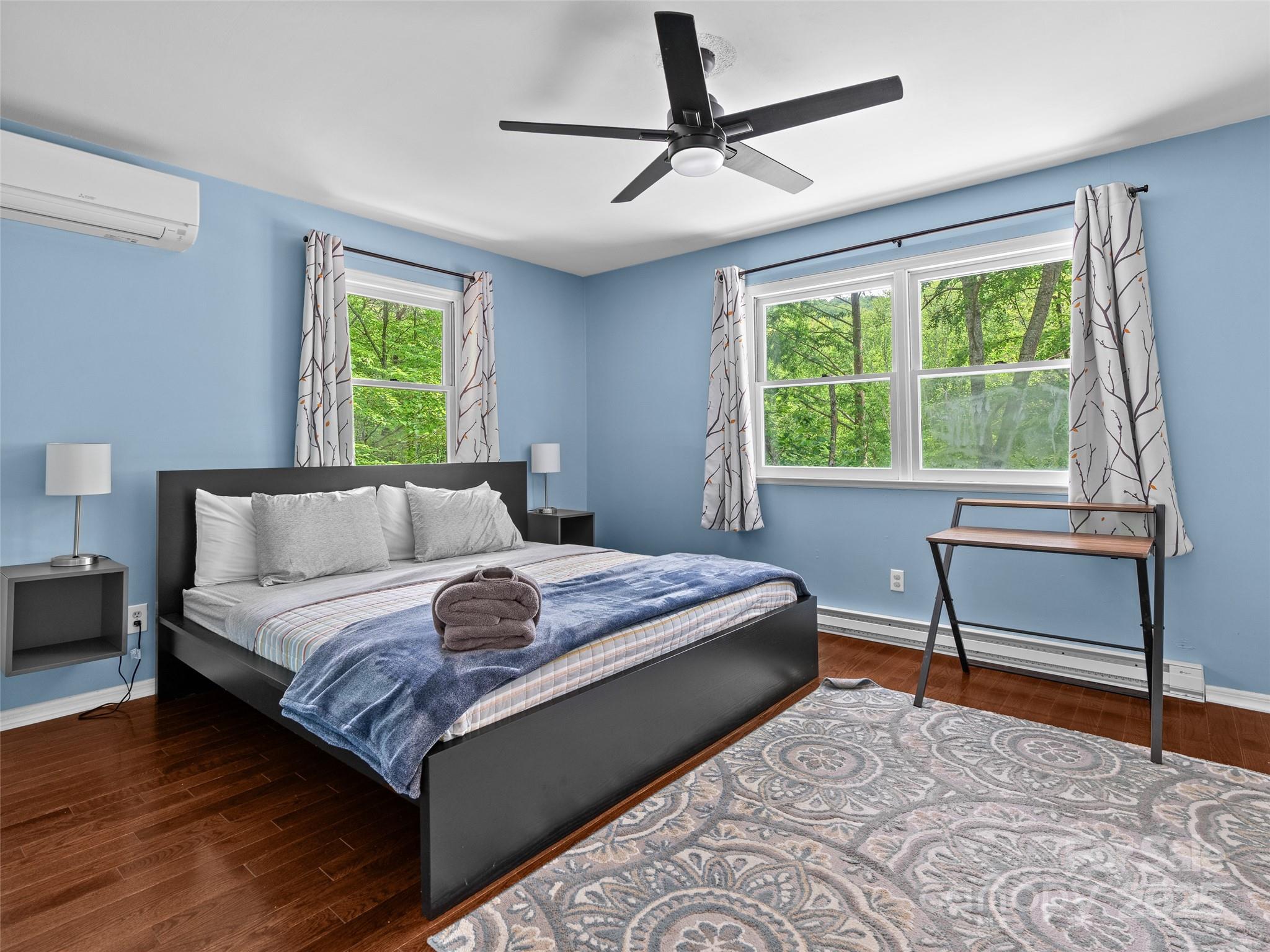 220 Deer Run Road Canton, NC 28716 - Photo 18 of 46 a bedroom with a bed and a window