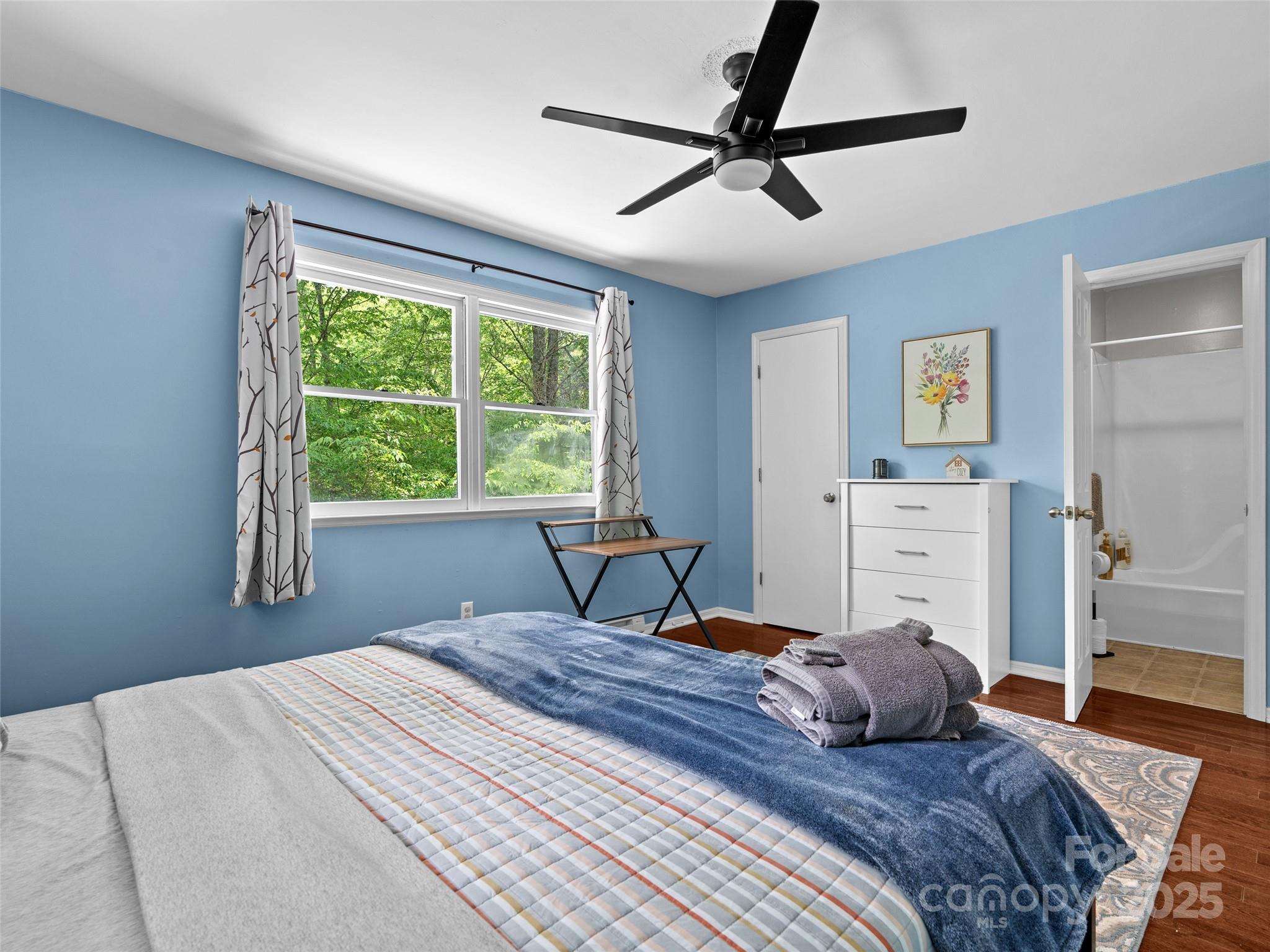220 Deer Run Road Canton, NC 28716 - Photo 19 of 46 a bedroom with a large bed and a window