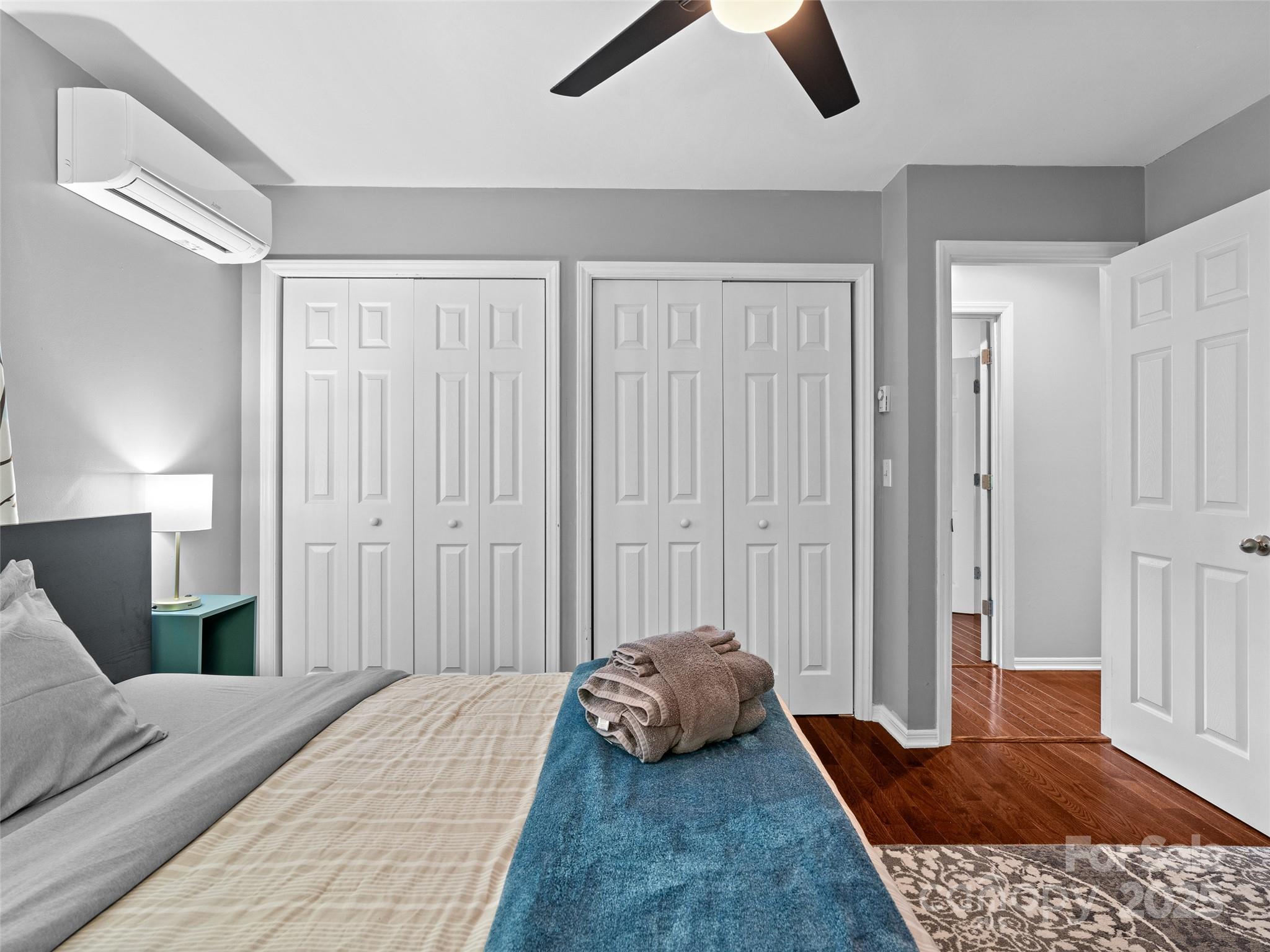 220 Deer Run Road Canton, NC 28716 - Photo 23 of 46 a bedroom with a bed and wooden floor