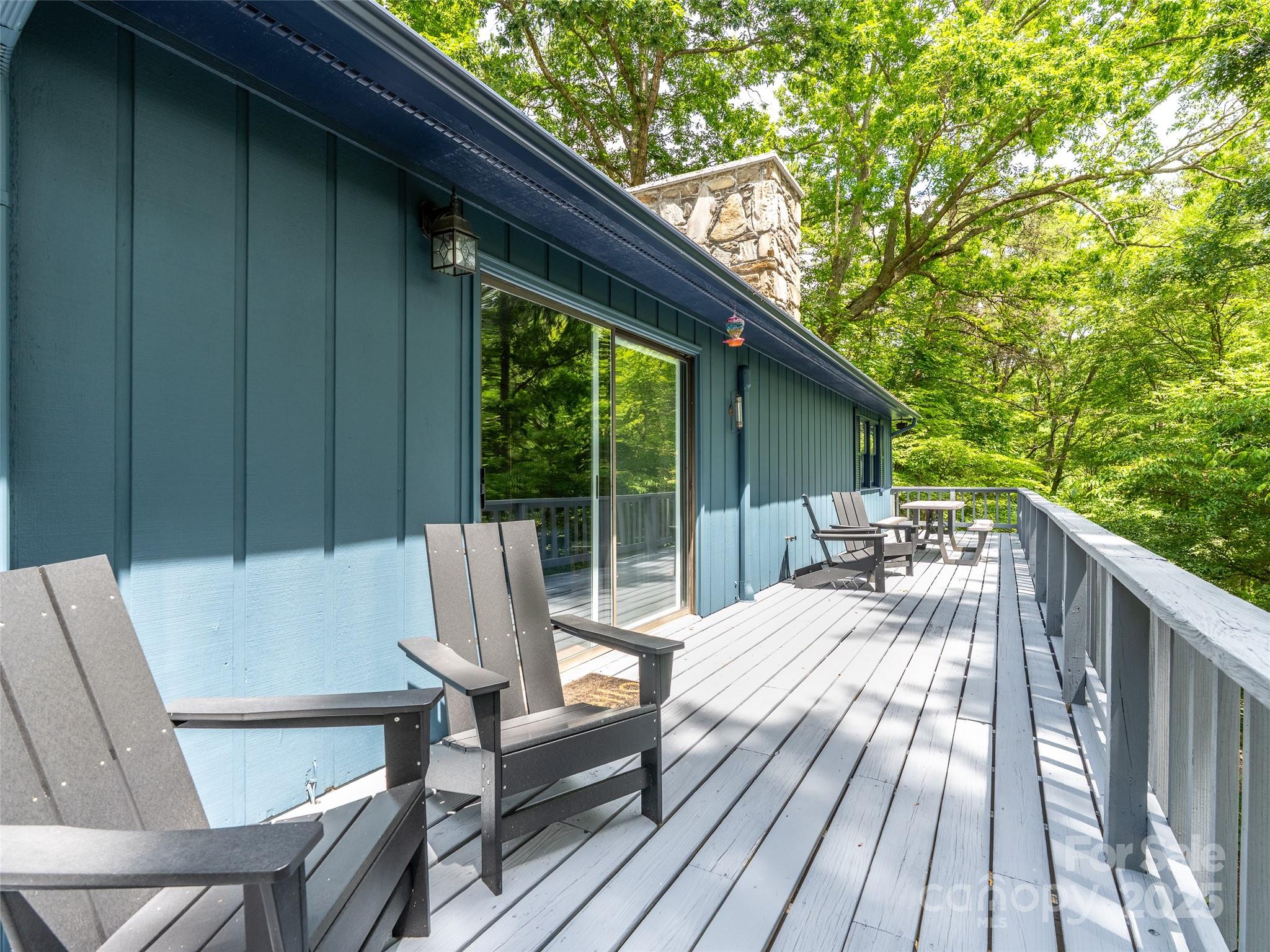 220 Deer Run Road Canton, NC 28716 - Photo 25 of 46 a view of backyard with a patio and wooden floor