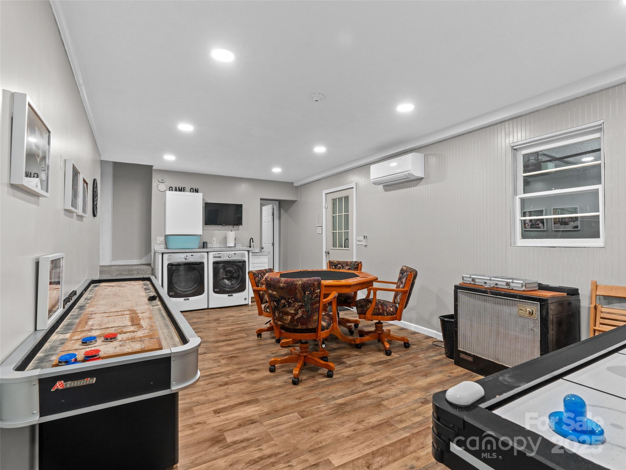 220 Deer Run Road Canton, NC 28716 - Photo 29 of 46 a living room with furniture a fireplace and a flat screen tv
