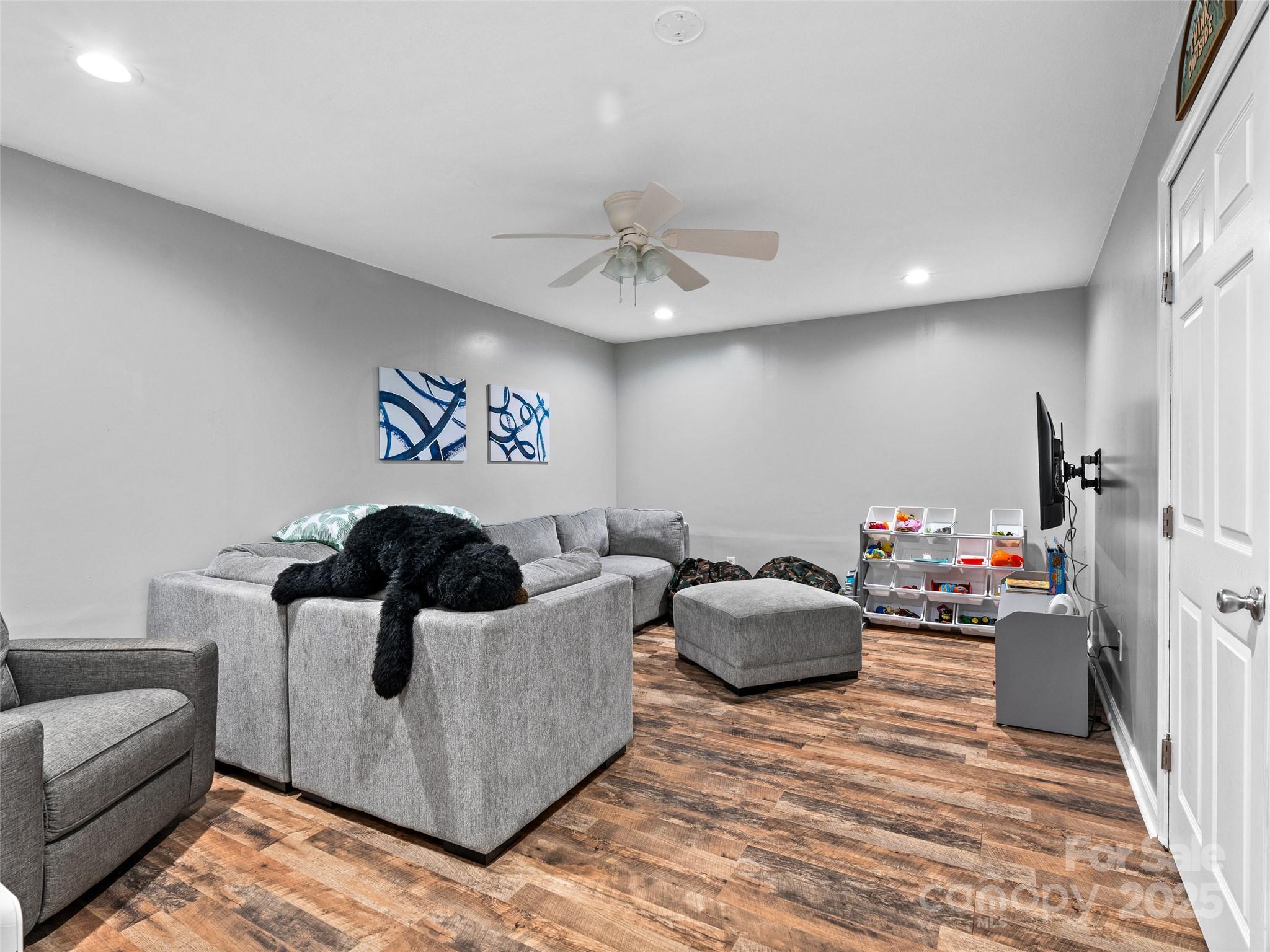 220 Deer Run Road Canton, NC 28716 - Photo 31 of 46 a bedroom with furniture and a couch