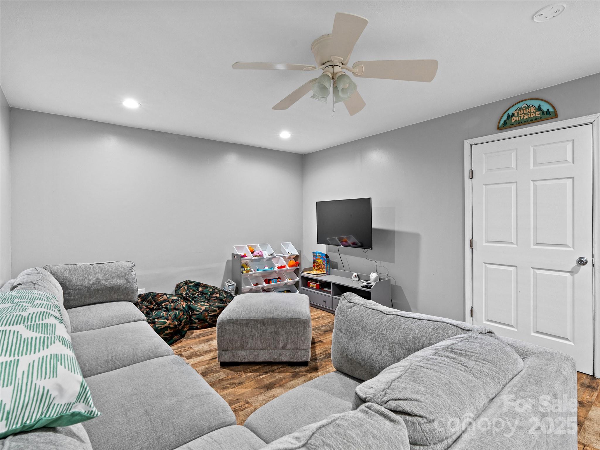 220 Deer Run Road Canton, NC 28716 - Photo 32 of 46 a living room with furniture and a flat screen tv