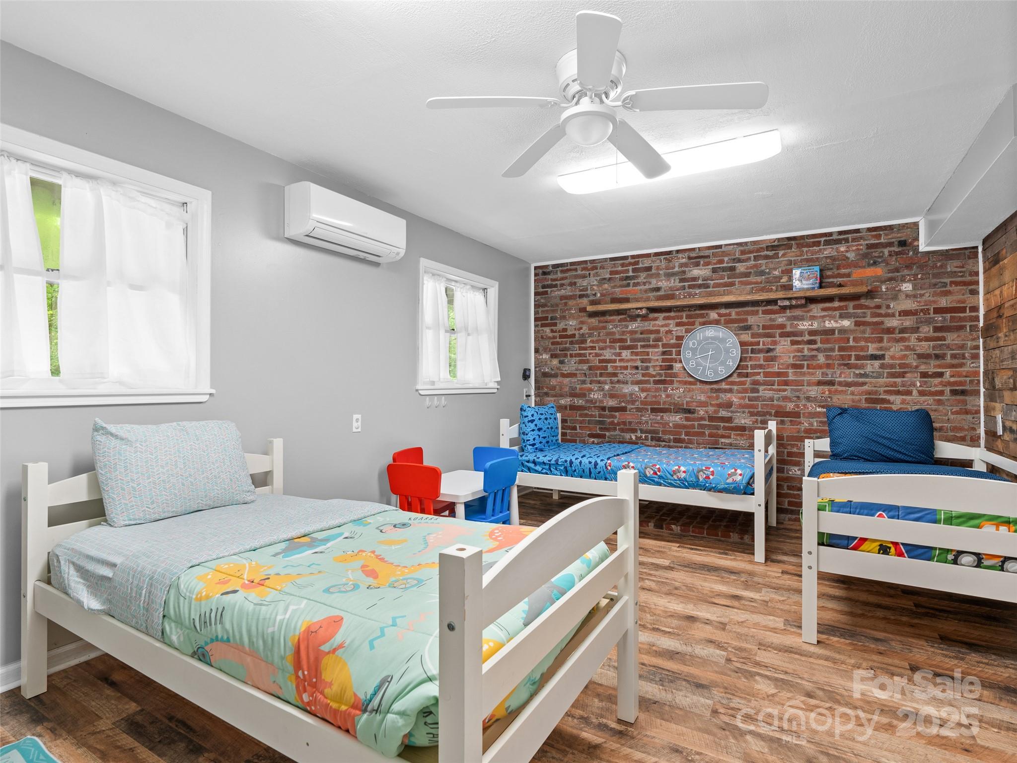 220 Deer Run Road Canton, NC 28716 - Photo 33 of 46 a bedroom with bed and windows