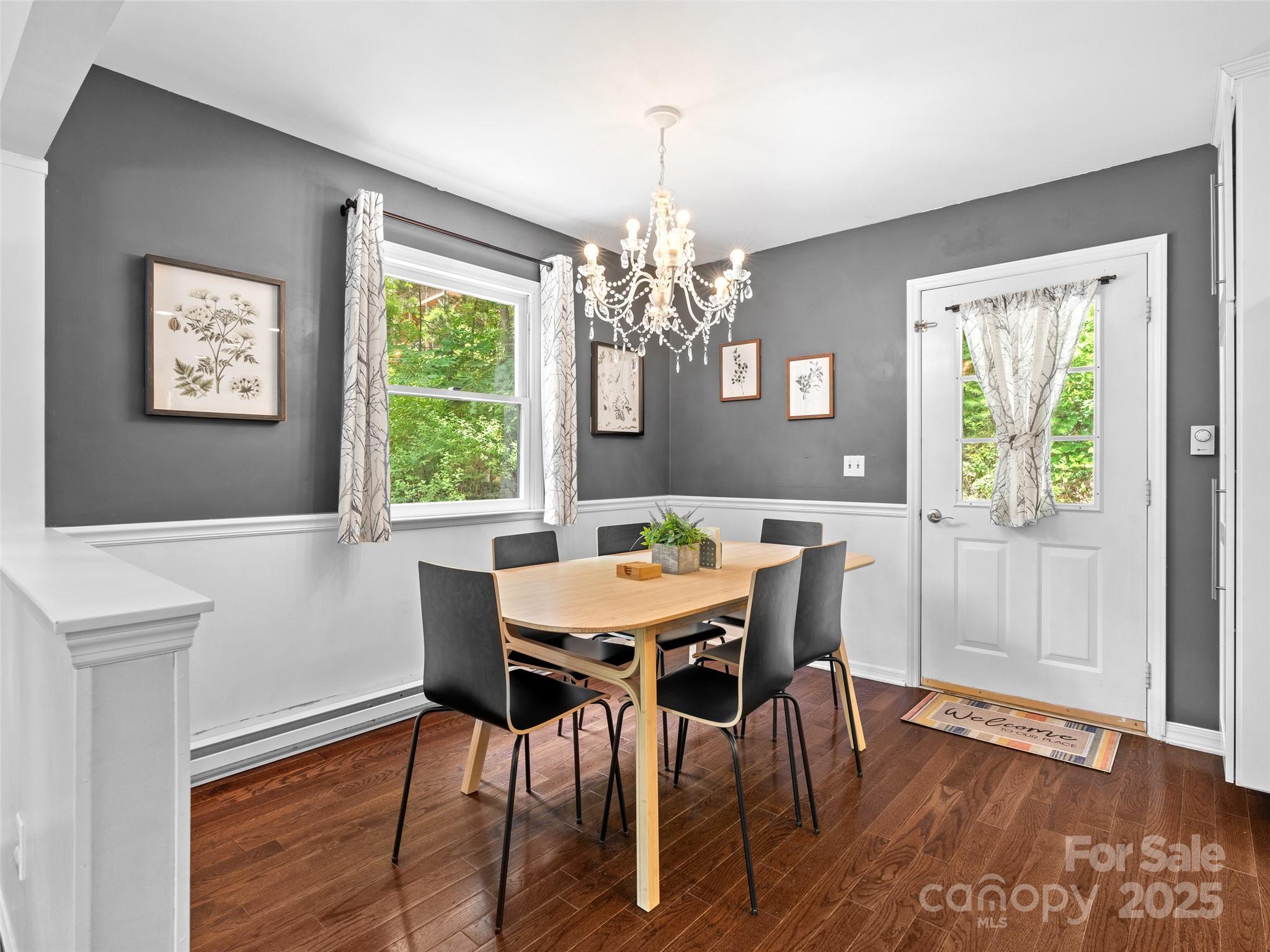 220 Deer Run Road Canton, NC 28716 - Photo 10 of 46 a view of a dining room with furniture window and wooden floor