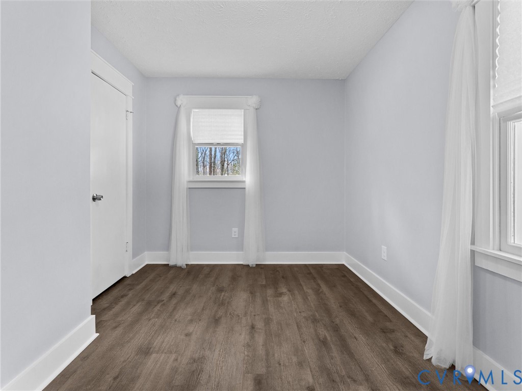 1339 Harris Creek Road Louisa, VA 23093 - Photo 30 of 42 an empty room with wooden floor and windows