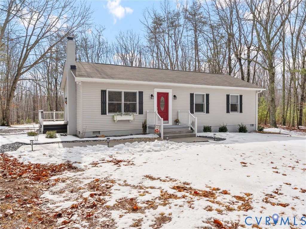 1339 Harris Creek Road Louisa, VA 23093 - Photo 3 of 42 a view of a house with a yard covered in snow