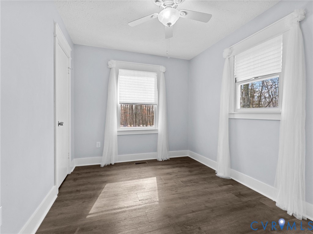 1339 Harris Creek Road Louisa, VA 23093 - Photo 32 of 42 an empty room with wooden floor and windows