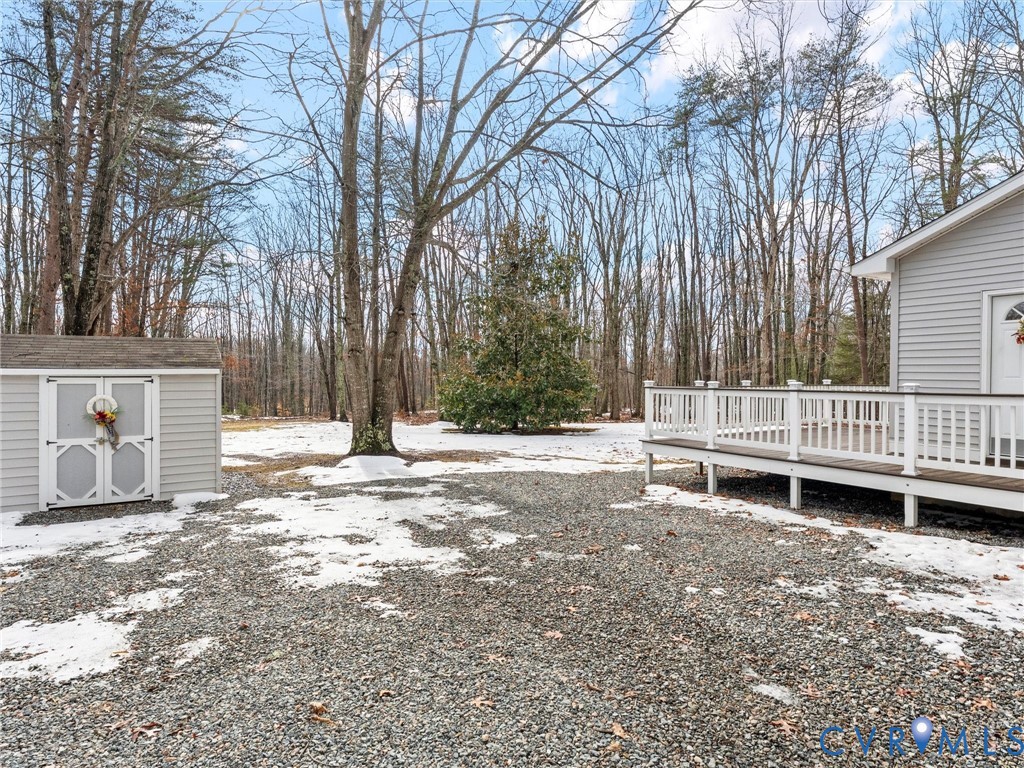 1339 Harris Creek Road Louisa, VA 23093 - Photo 38 of 42 a backyard of a house with a bench and trees