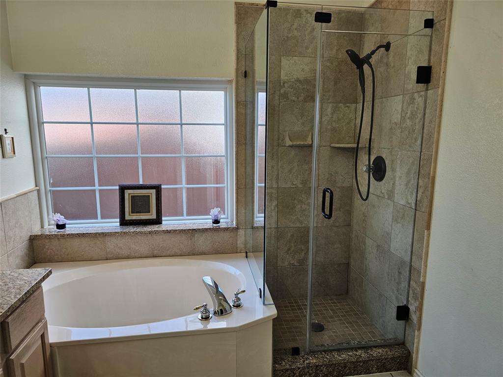 7783 Park Run Road Fort Worth, TX 76137 - Photo 14 of 20 Primary Bath with w updated Tile surround and fuxtures