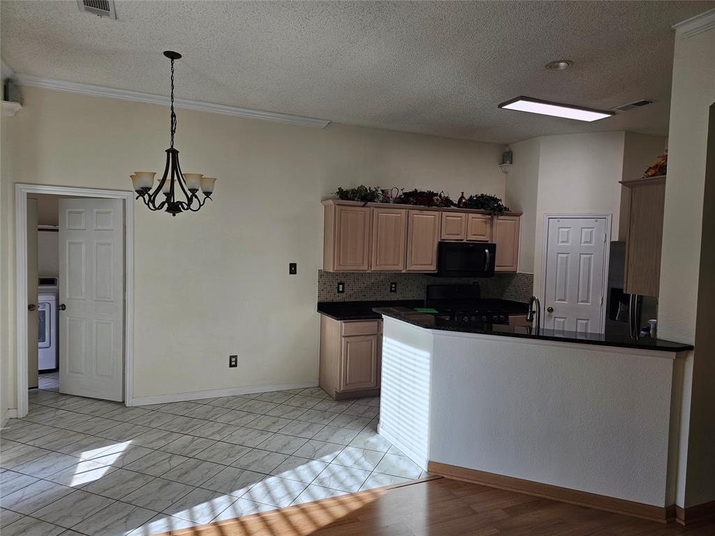 7783 Park Run Road Fort Worth, TX 76137 - Photo 7 of 20 Kitchen and nook are open to Family room