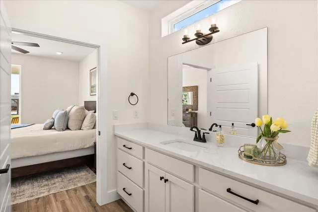 a en suite bathroom with double sink and a mirror