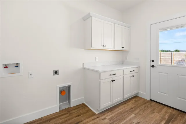 a view of cabinets with wooden floor